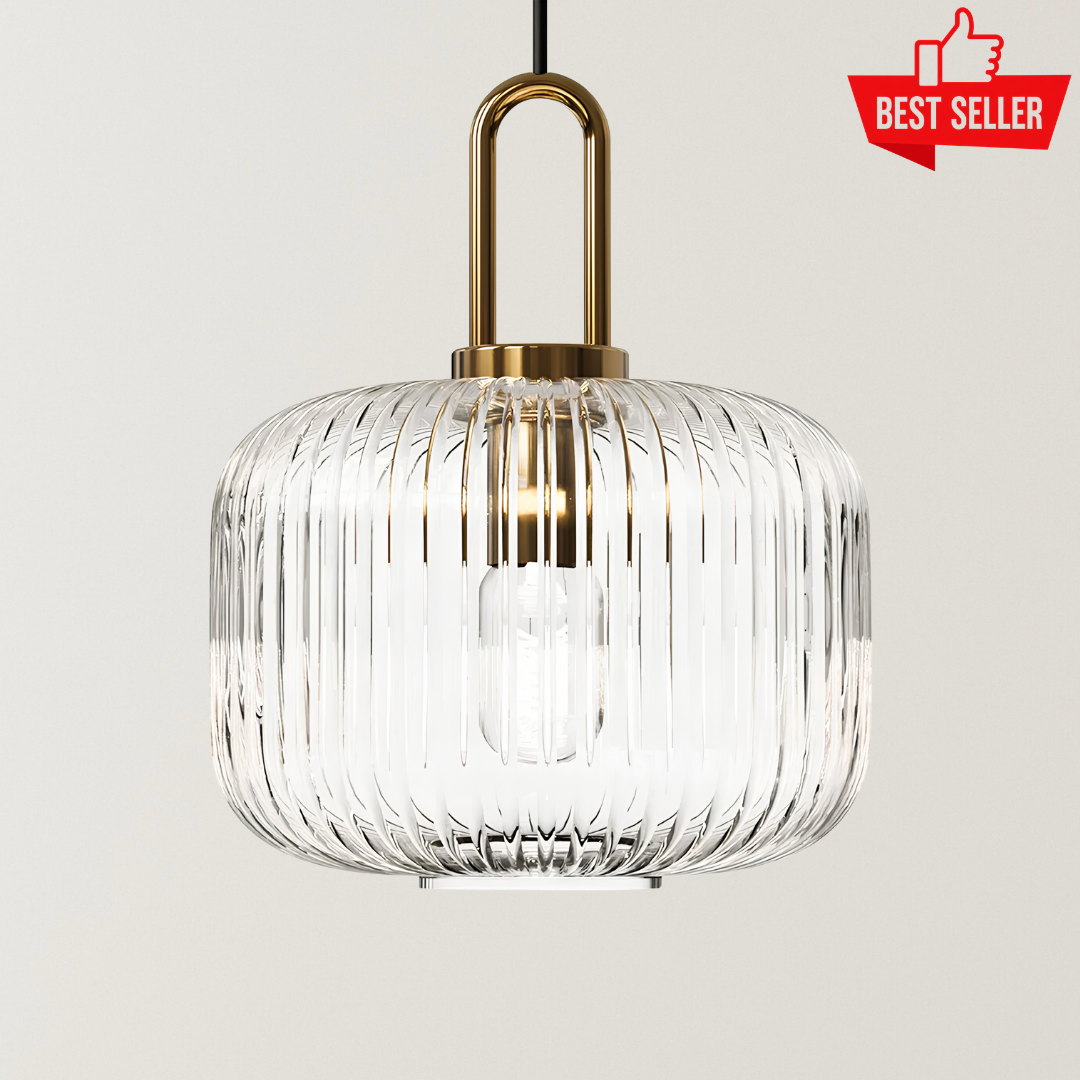 Ella Nordic glass pendant lamp with a ribbed clear glass shade, gold accents, black suspension cord, and soft warm glow for modern interiors.