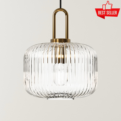 Ella Nordic glass pendant lamp with a ribbed clear glass shade, gold accents, black suspension cord, and soft warm glow for modern interiors.