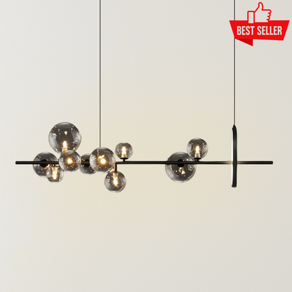 Freya hanging glass ball LED light with a slim black linear frame, smoky glass globe shades, warm glowing bulbs, and adjustable suspension against a neutral background.