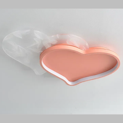 Warm LED light for a cozy bedroom with heart-and-star styling.