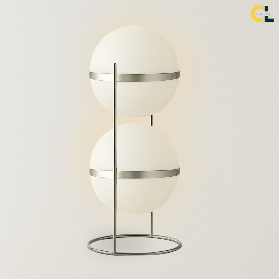 Magnus Floor Lamp with two stacked frosted acrylic globe shades, slim stainless steel frame, and circular base, designed for soft modern lighting in bedrooms, living rooms, offices, and reading corners.