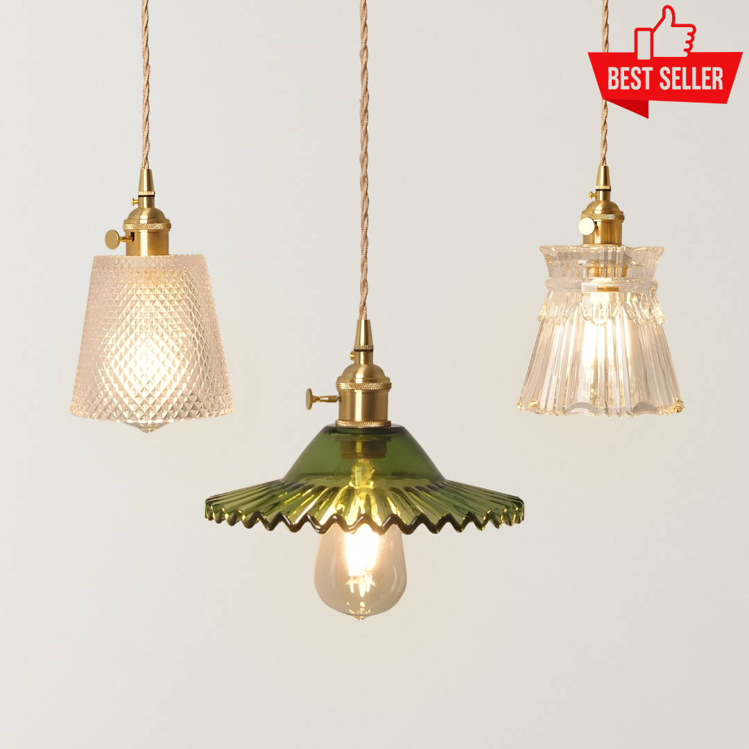Nimira vintage glass pendant lights with brass-finished holders, textured clear and green glass shades, twisted cords, and warm ambient glow.