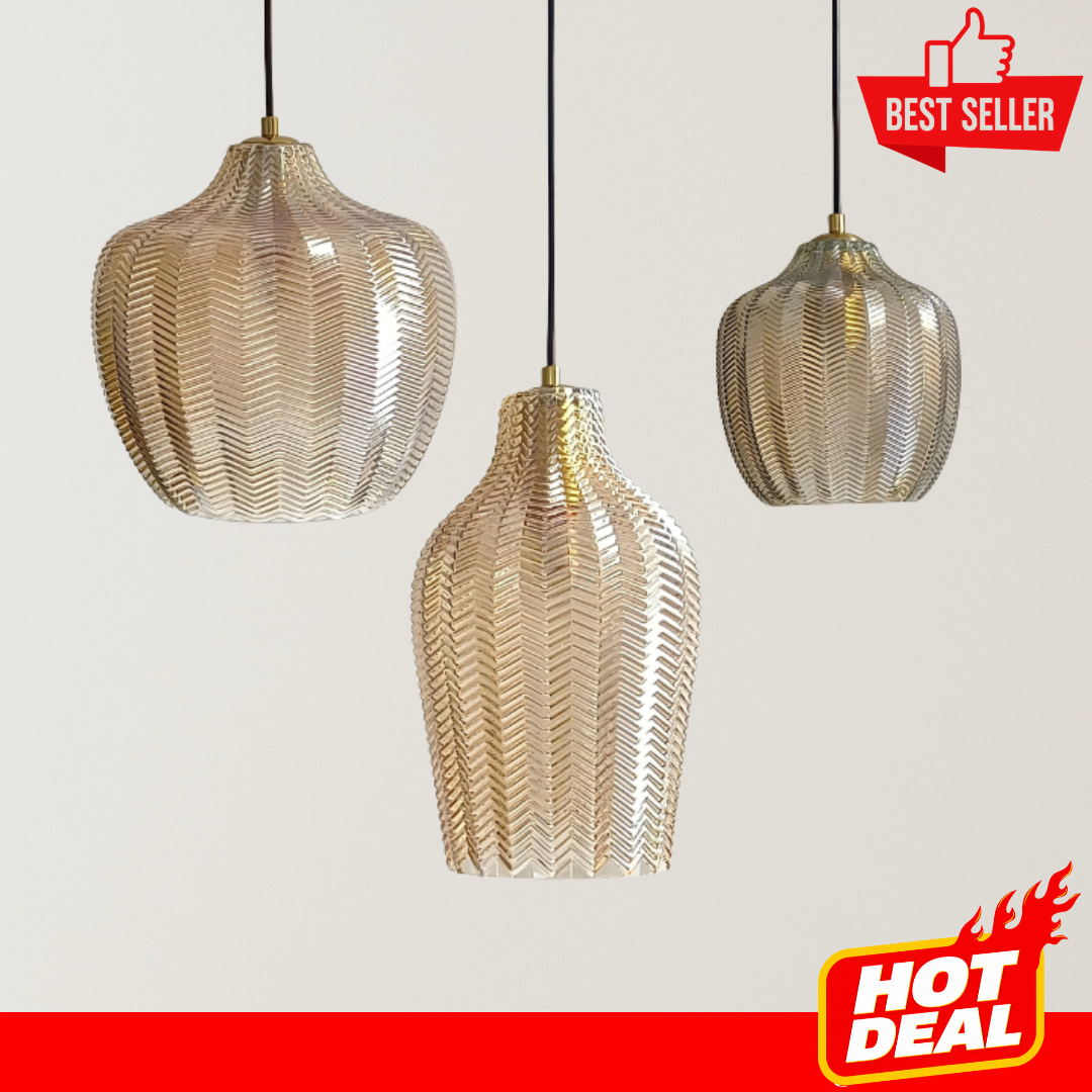 Shella glass pendant lights with translucent textured shades, black cords, gold accents, and soft mid-century modern glow for dining rooms, bedrooms, or kitchen islands.