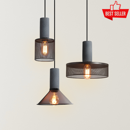 Simone Loft Style Industrial Pendant Lights with cement-textured cylinders, smoked metal mesh shades, exposed warm bulbs, and Nordic industrial hanging design.